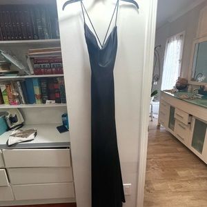 Dvf black silk dress cowl neck open back with a silt in the front will fit 0-4